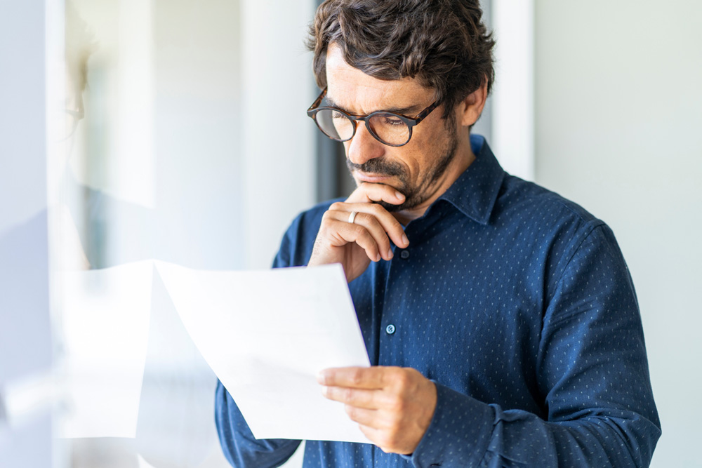 Businessman-holding-a-paper-document