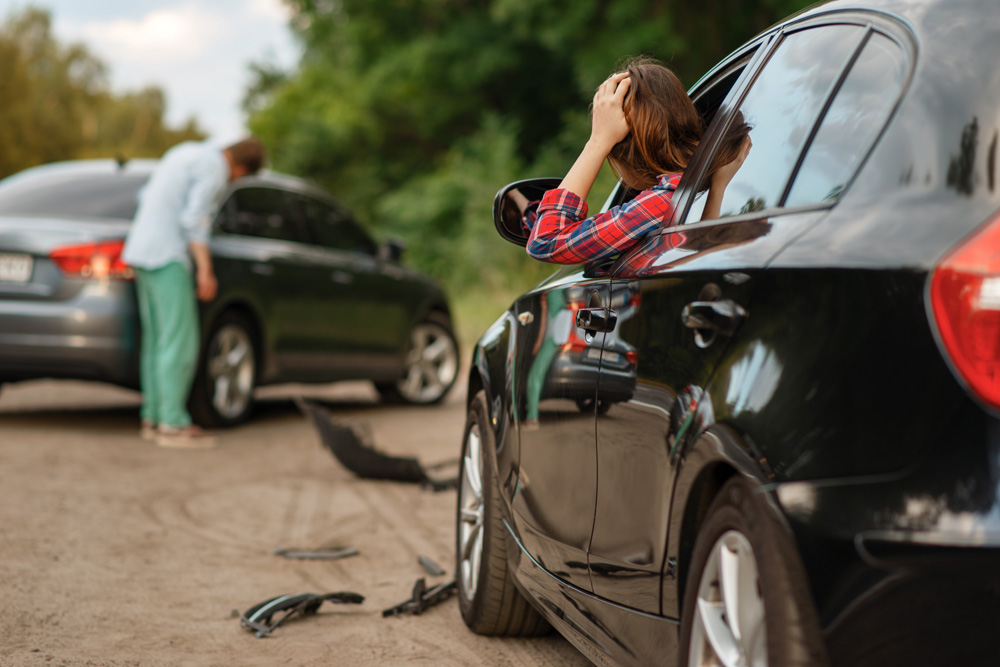 Male-and-female-drivers-after-car-accident-on-road