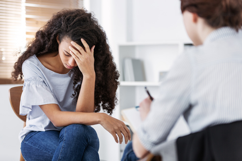 Professional-psychotherapies-and-young-woman-suffering-from-ptsd