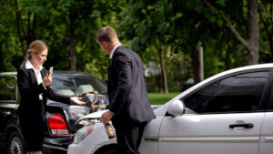 Stressed woman calling police standing car collision scene near drunk driver
